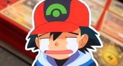 weinender Ash vor Sammelkarten