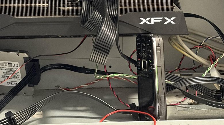 A player supports his graphics card with the most robust device in human history, which might even survive the end of the world